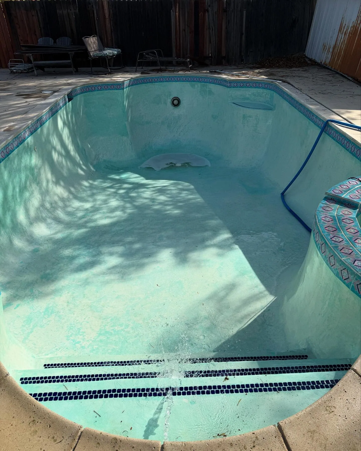 Drained pool after acid wash, ready to refill